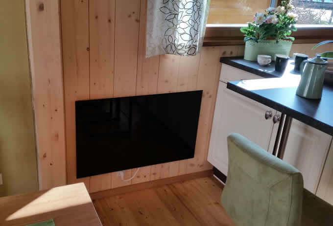 Kitchen uses Sundirect glass infrared heater in Austria